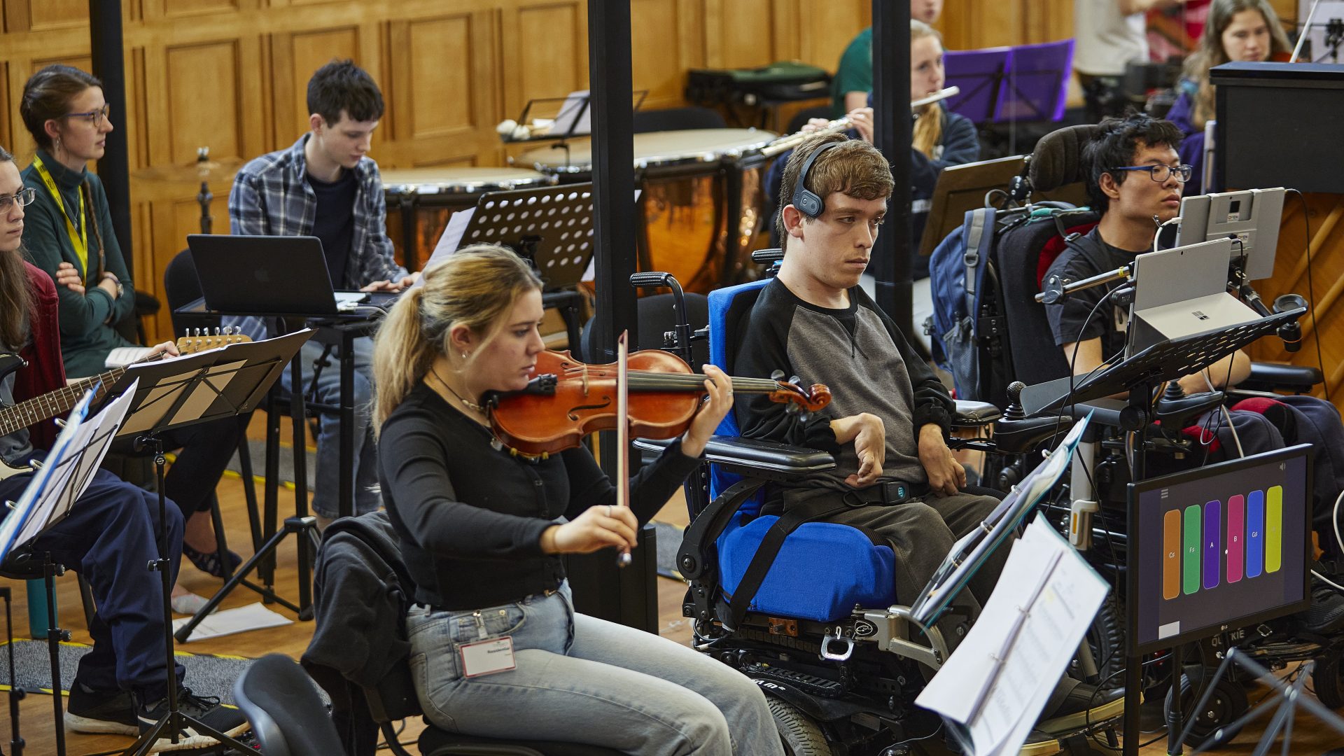 NOYO musicians playing various instruments during a NOYO rehearsal.