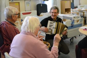 Hugh Nankivell making music with Music for a While participants