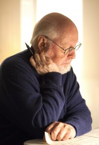 John Williams looking at a piece of paper