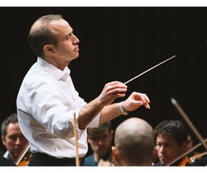 The BSO's incoming Chief Conductor Mark Wigglesworth conducts the BSO, wearing a white shirt