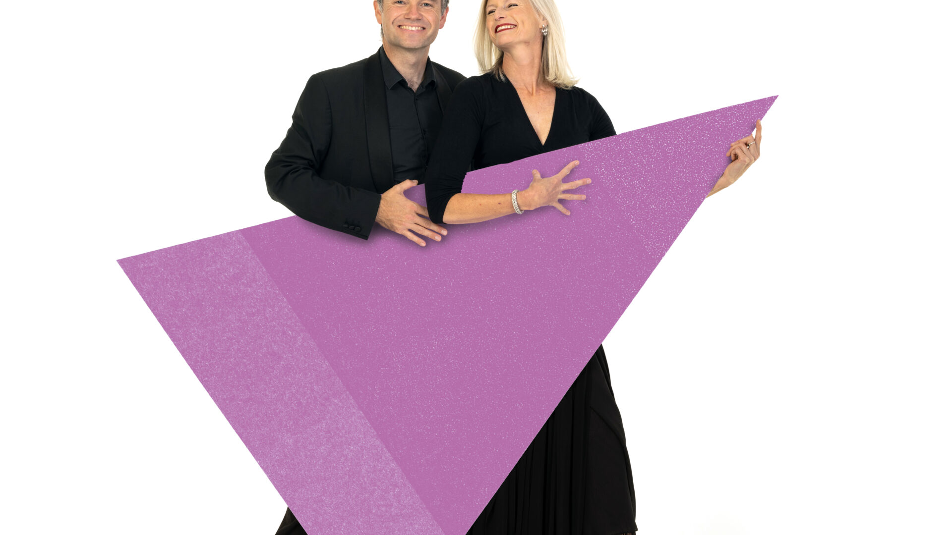 2 BSO musicians standing behind a purple triangle