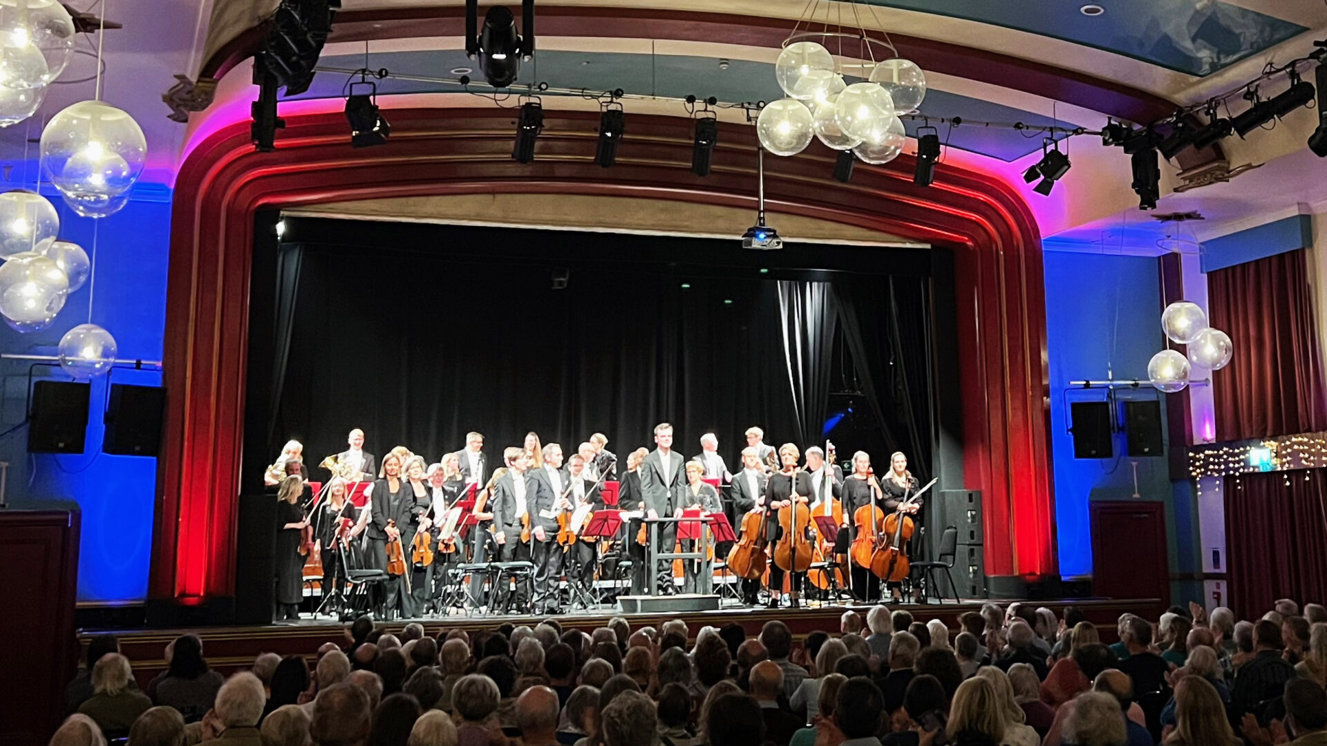 The Orchestra and conductor Tom Fetherstonhaugh at Exmouth Pavilion