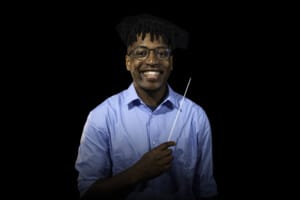 The BSO's new Calleva Assistant Conductor, Enyi Okpara, poses for photograph holding conductor's baton