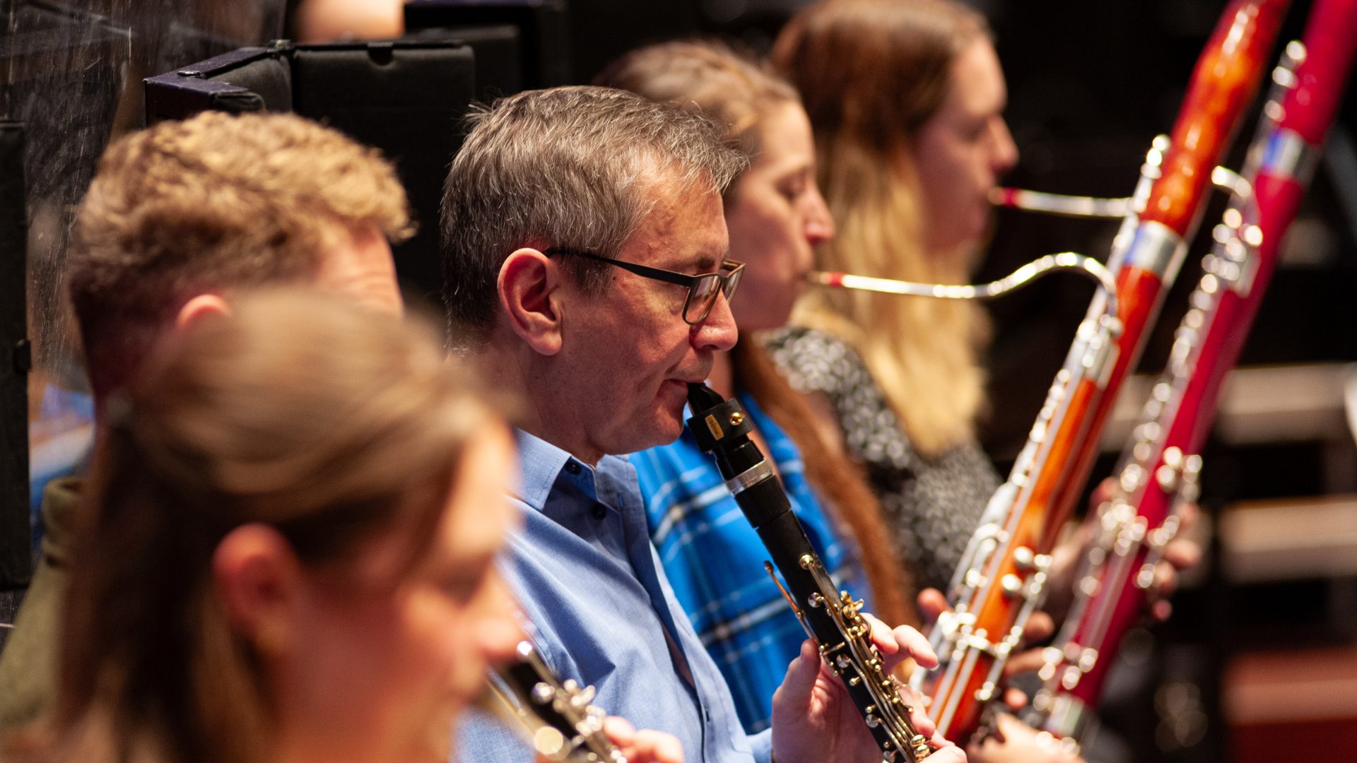 The BSO Wind section playing during rehearsal, with Principal Clarinet Barry Deacon in focus.