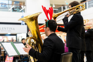 Musicians play music for shoppers