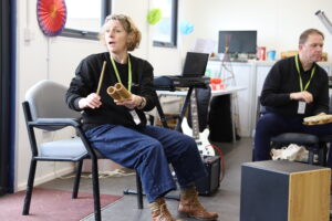 Music leaders play instruments with Somerset Wellbeing Orchestra