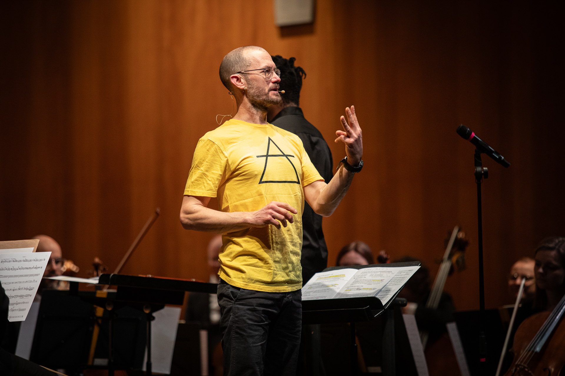 Presenter James Redwood encourages an audience from the stage